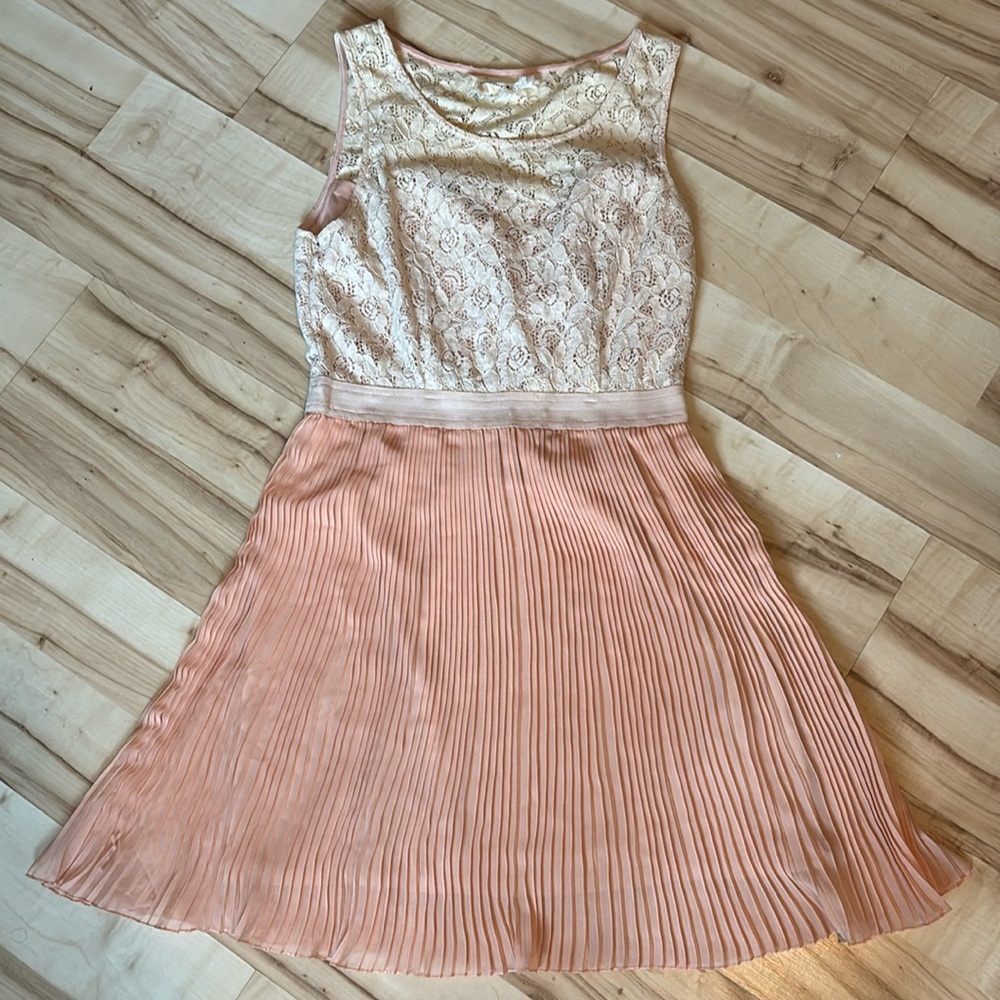 Woman’s pleaded dress